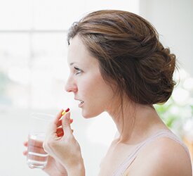 Woman taking medication