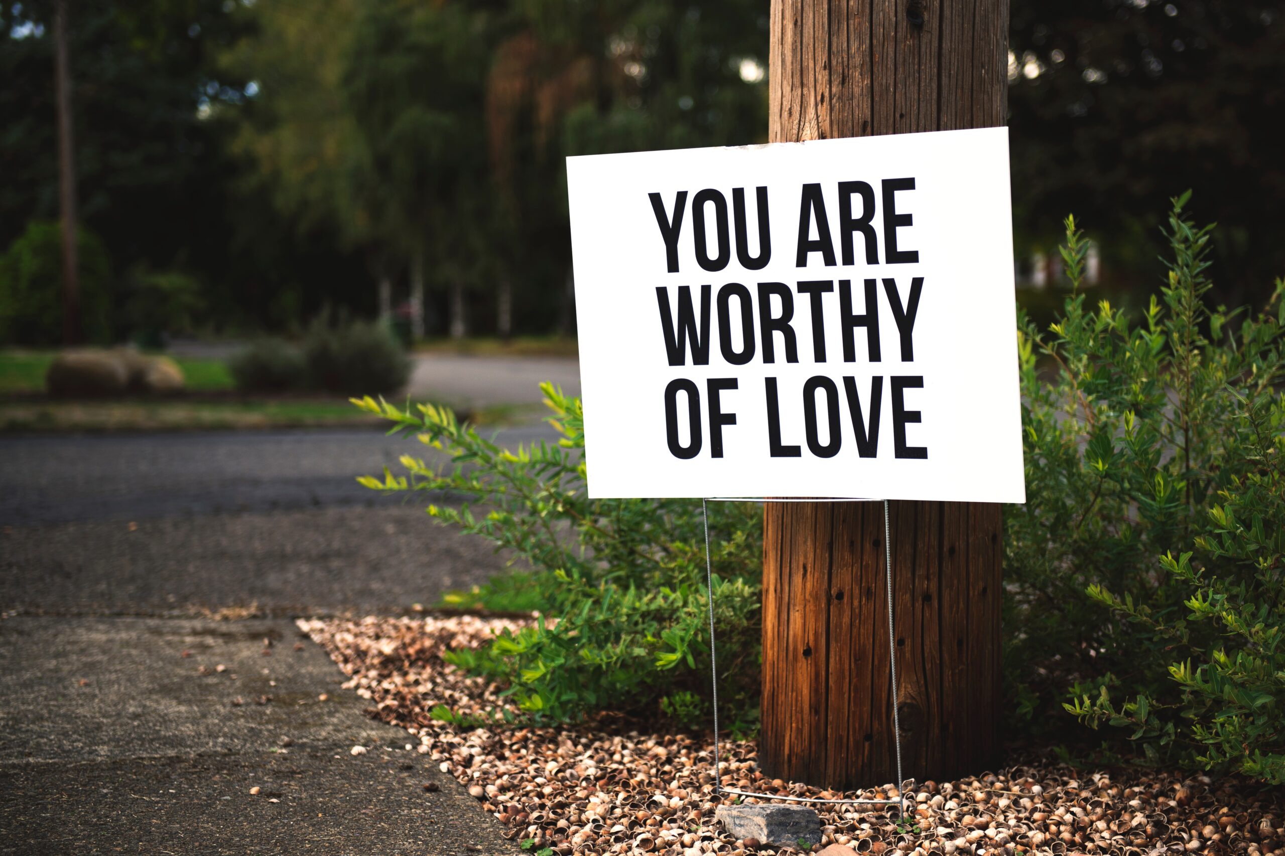 a sign with positive words of affirmation for self love